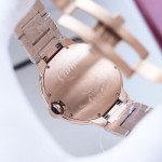 Cartier Ballon Bleu series, 33mm women's watch with silver dial, rose gold strap, quartz watch.