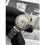 Cartier Ballon Bleu, 33mm, silver dial with diamond-set bezel, two-tone gold and silver.