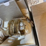 Bulgari Serpentl Collection: White dial with diamonds and gold snake bezel