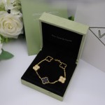 Four-leaf clover gold-plated black bracelet