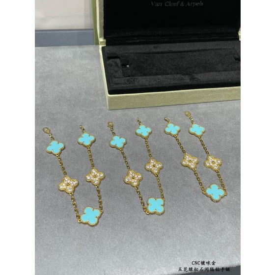 Four-leaf clover gold bracelet with rhinestones and blue accents
